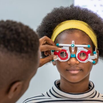 When should children have their first comprehensive eye examination?